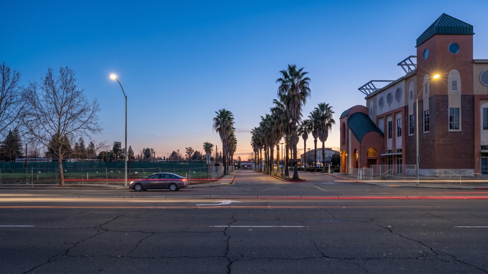 AI-rendered blue hour view of the empty retail center site on Stockton Boulevard in South Sacramento's Little Saigon, based on 2025 street imagery