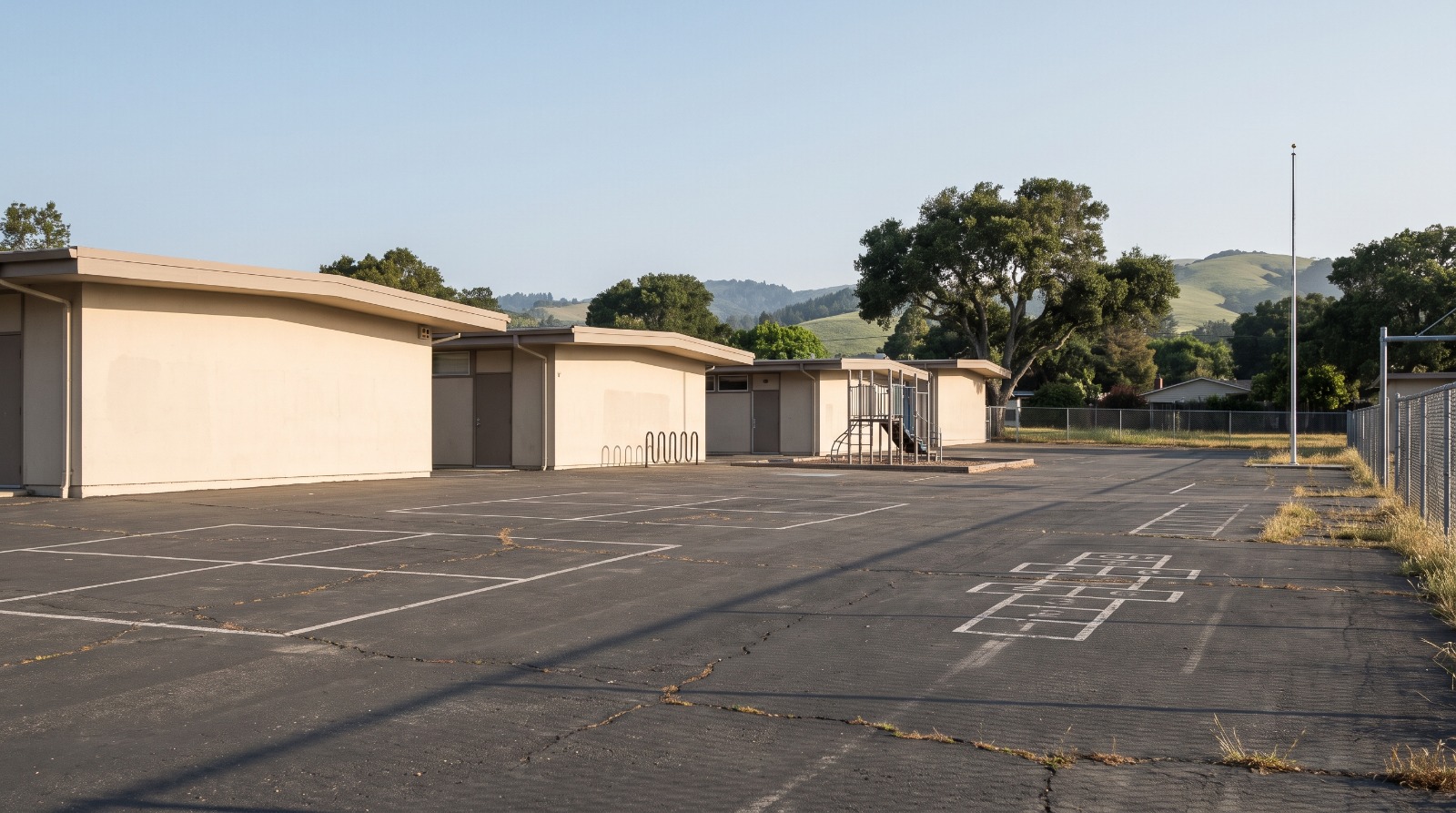 A quiet Peninsula elementary school campus in a San Carlos-style neighborhood, where San Mateo school enrollment trends vary widely by district.