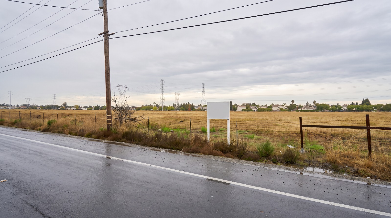 AI-rendered view of the open field on the east side of Waterman Road north of Rancho Drive in Elk Grove, the proposed Summer Flats site, after rain