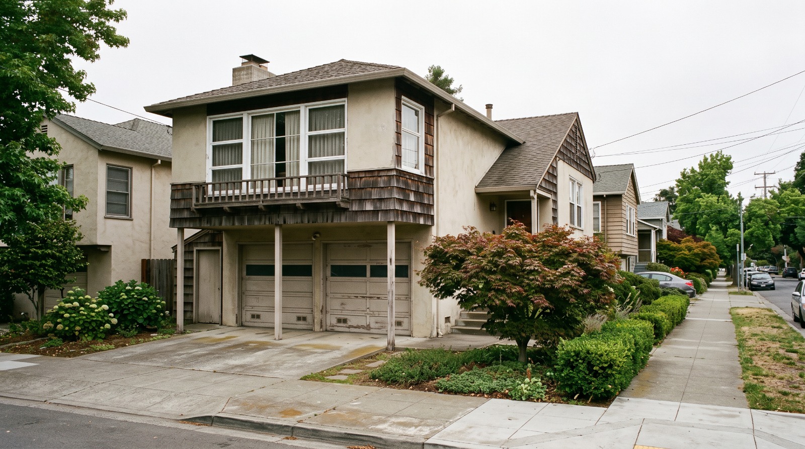 A post-war Bay Area house with a living room built out over an attached two-car garage