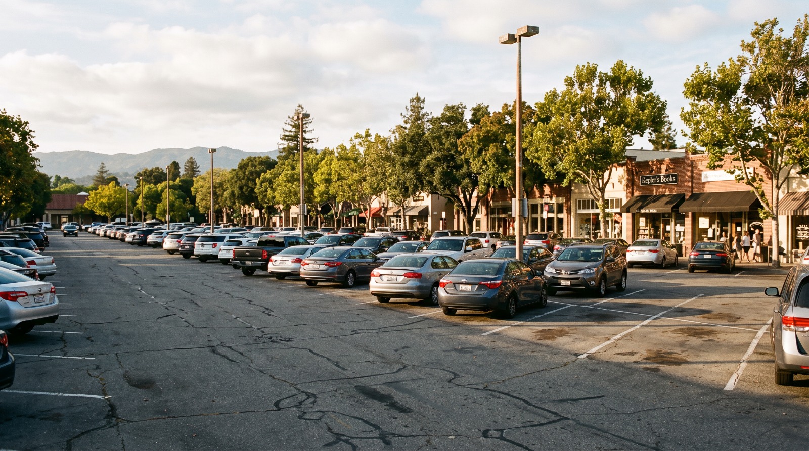 Surface parking lot in downtown Menlo Park, California, the kind of city-owned land at the center of a November 2026 housing ballot measure.