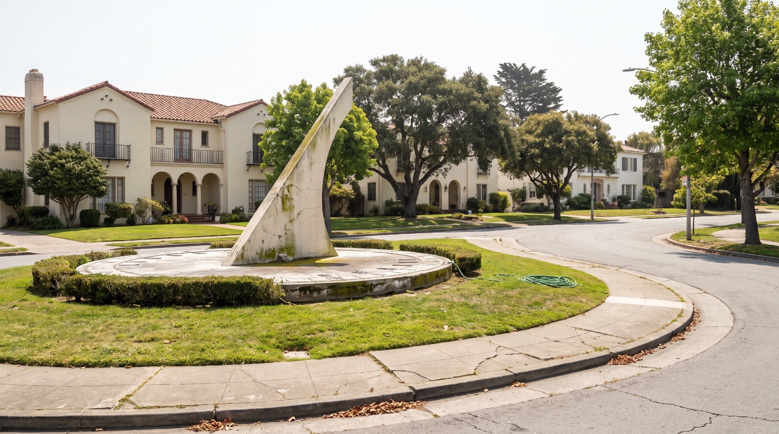 The concrete sundial monument on the Urbano Drive median in Ingleside Terrace, San Francisco, ringed by 1920s stucco homes