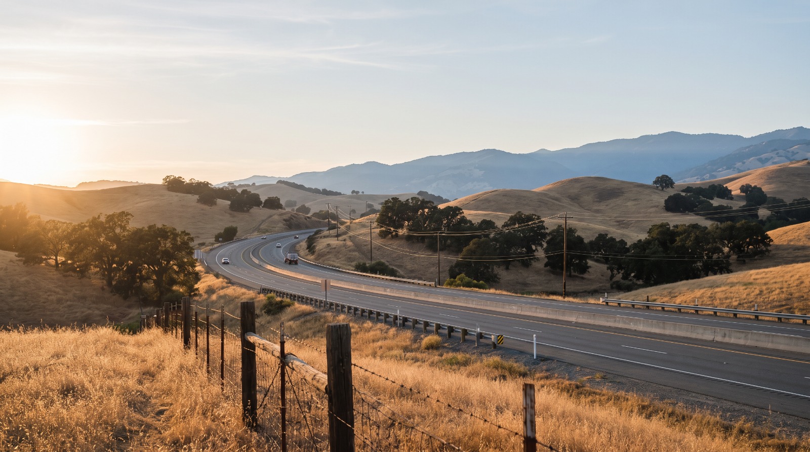 State Route 152 curving into the Diablo Range toward Pacheco Pass east of Gilroy at golden hour