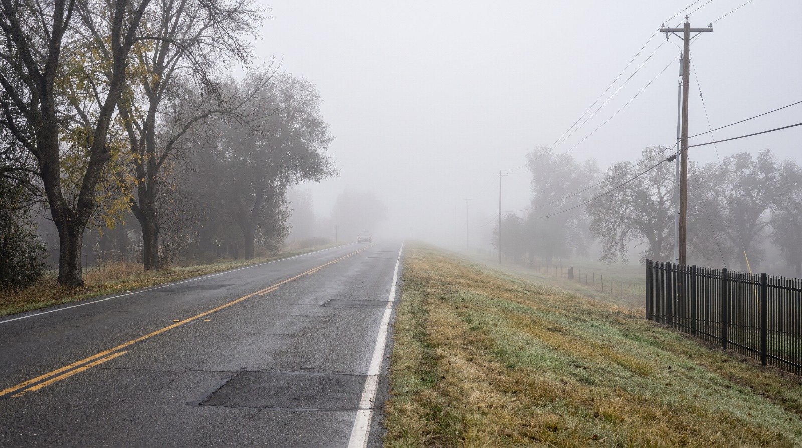 AI-rendered view of the Garden Highway on top of the Sacramento River levee at the edge of Natomas on a foggy winter morning