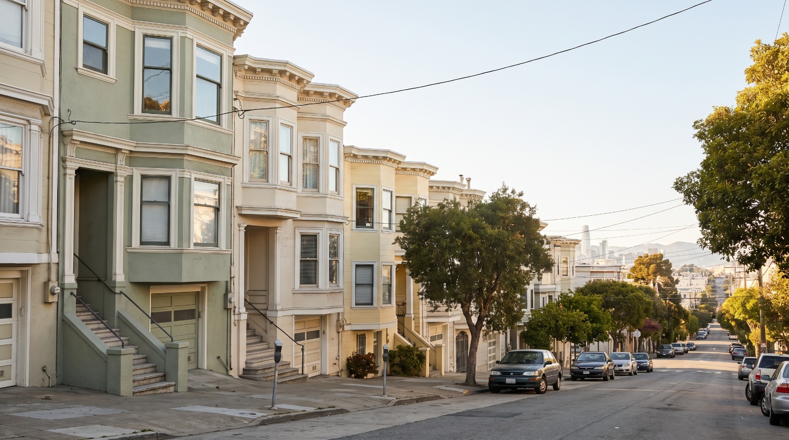 A sunny block of pastel Victorian row houses in Noe Valley, San Francisco, where Noe Valley homes lead the city in over-asking sales.