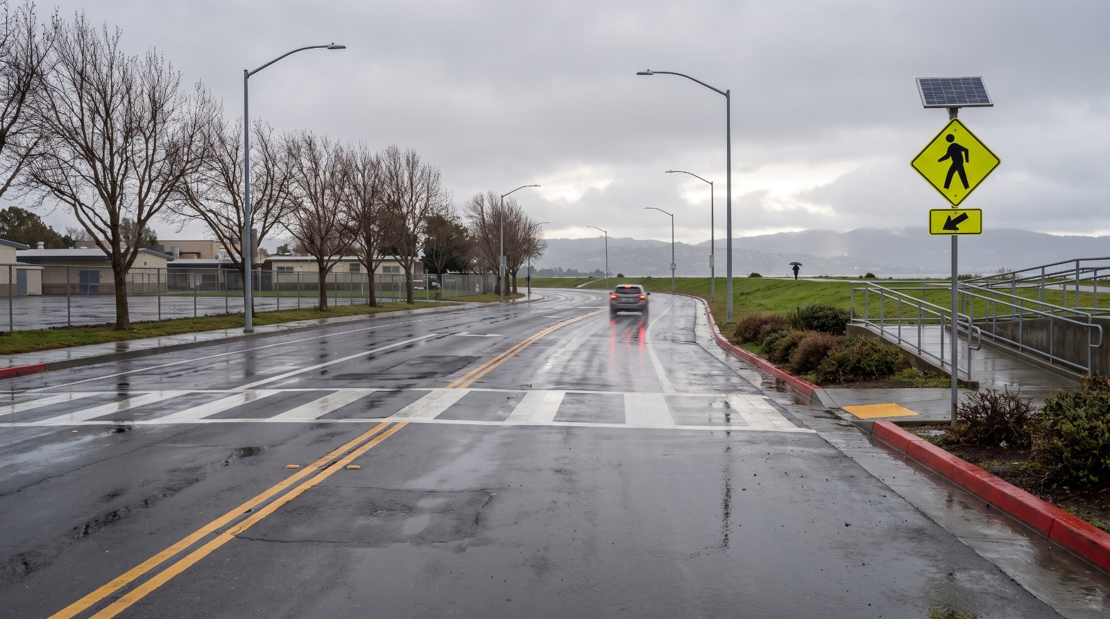 AI-rendered view of Beach Park Boulevard at Swordfish Street in Foster City after rain, looking north past the Bay Trail ramp