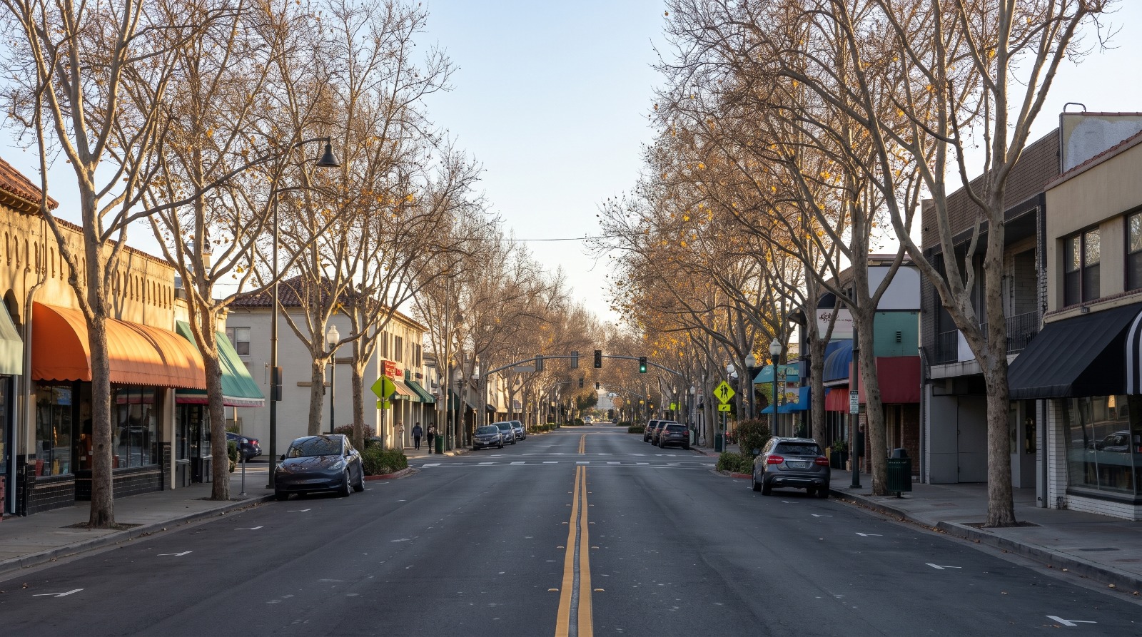 AI-rendered view of Lincoln Avenue in downtown Willow Glen, San Jose, storefronts with awnings under bare plane trees in late October afternoon light