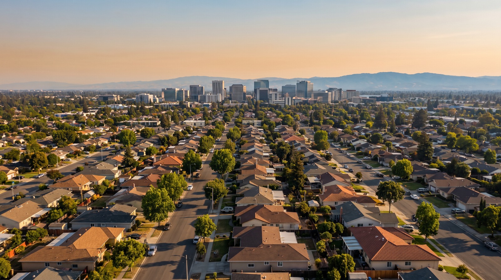 Aerial view of San Jose single-family neighborhoods with the downtown skyline in the distance, the land covered by the new zoning direction