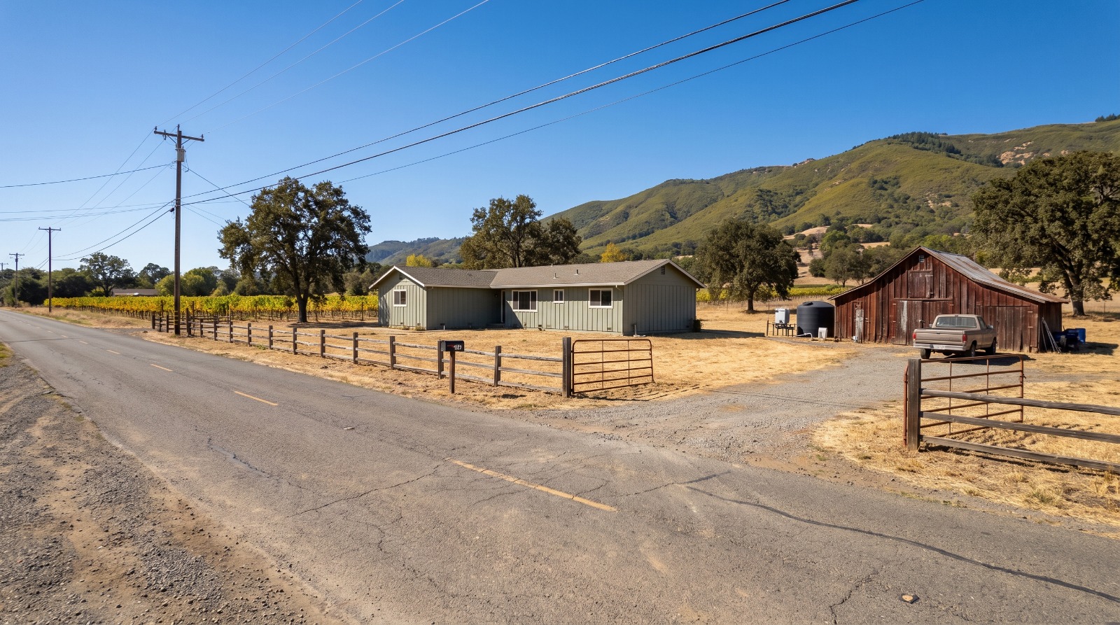 AI-rendered view of a rural ranch house, barn and open pasture on a country road in unincorporated Sonoma County