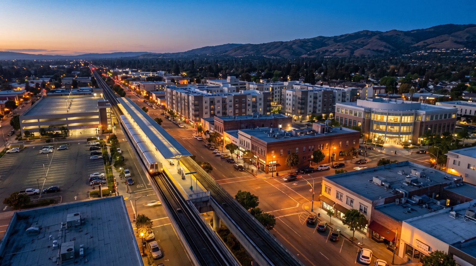 Aerial view of downtown Hayward and the BART station at blue hour, the area covered by the General Plan amendment