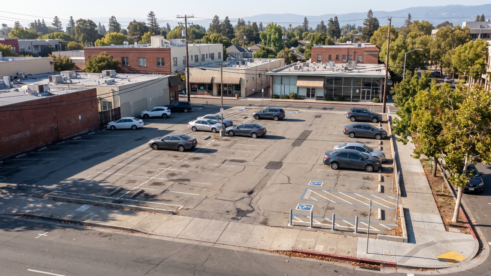 Elevated view of the city-owned surface parking lot at Hamilton Avenue and Waverley Street in downtown Palo Alto, the site of the approved six-story garage.