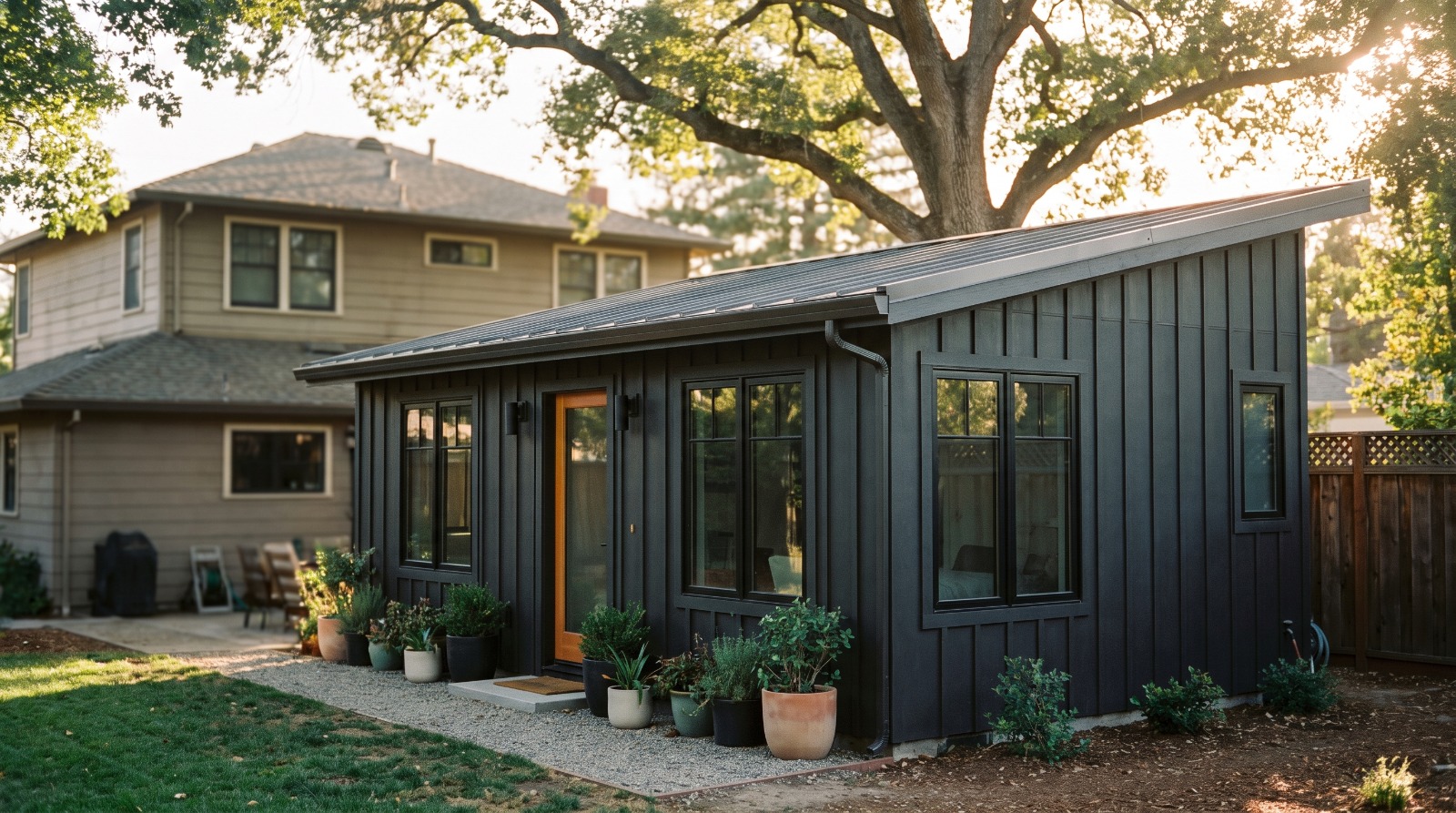 A newly built detached backyard ADU cottage behind an older Bay Area home, illustrating what California's 2026 ADU laws let homeowners build.