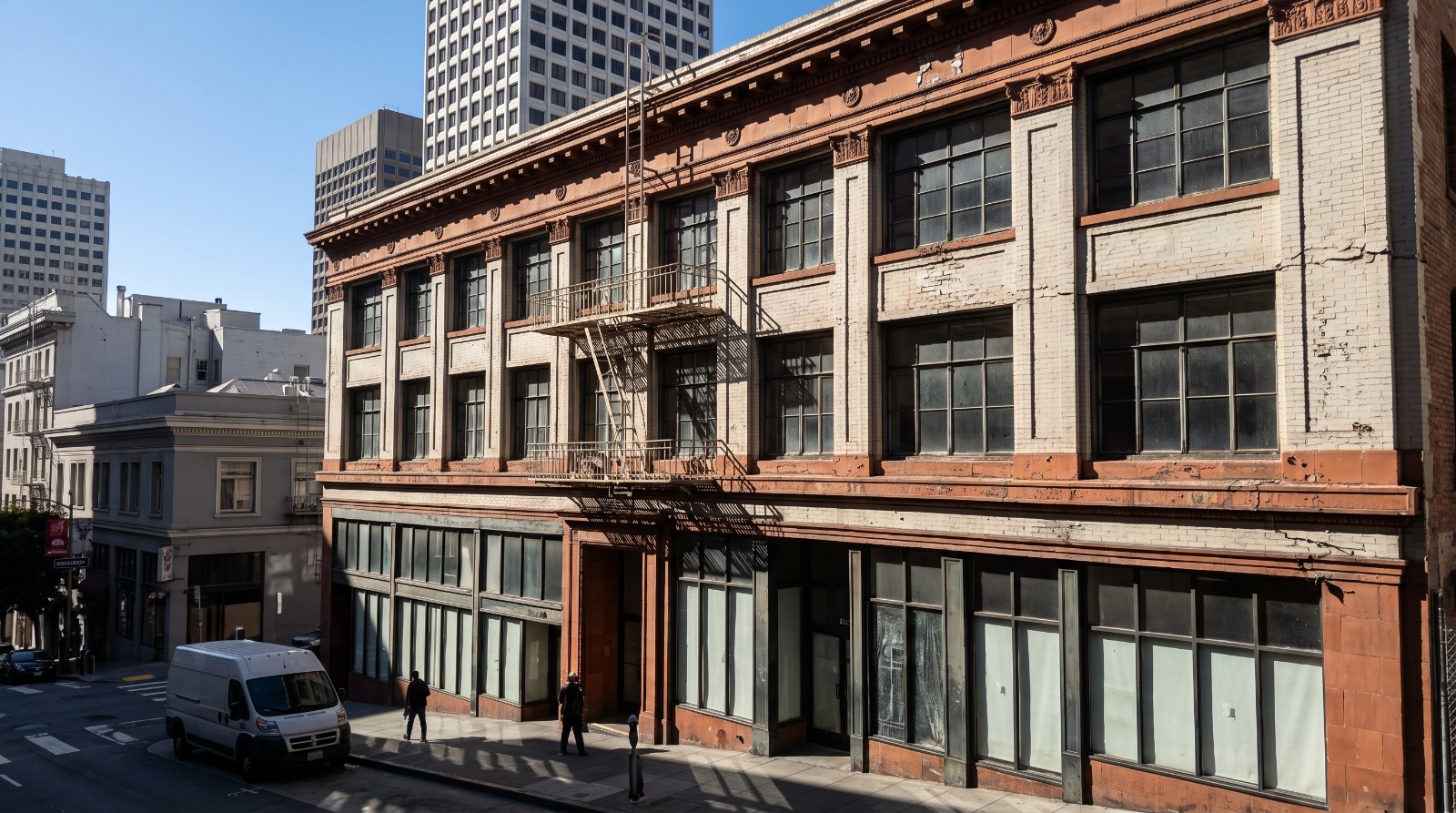 A 1920s masonry mid-rise on Sutter Street near Union Square in San Francisco, the kind of building now filing for office-to-housing conversion.