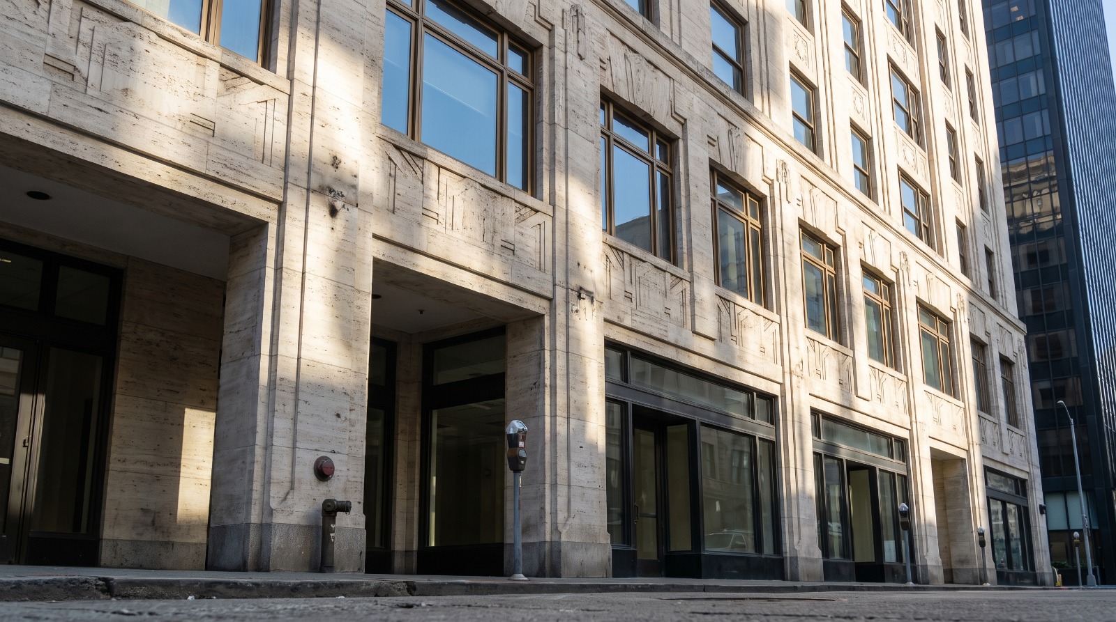 The limestone facade of a 1930s ten-story office building on Montgomery Street in San Francisco’s Financial District, where 417 Montgomery recently sold at a deep discount.