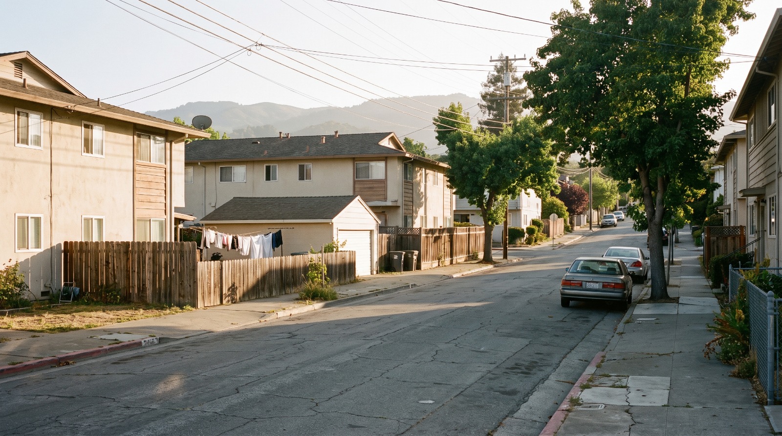 An older block of multifamily homes in Redwood City, where new rules allow up to eight backyard ADUs on a lot.