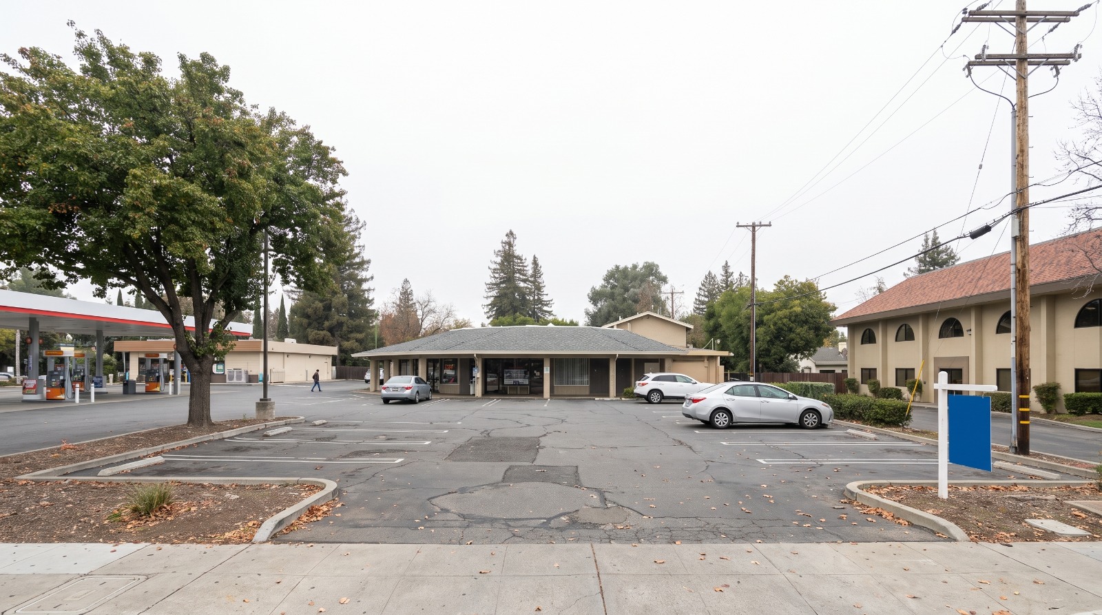 AI-rendered view of the strip mall at 1655 S. De Anza Boulevard in Cupertino as it looks today, with its parking lot and low retail building