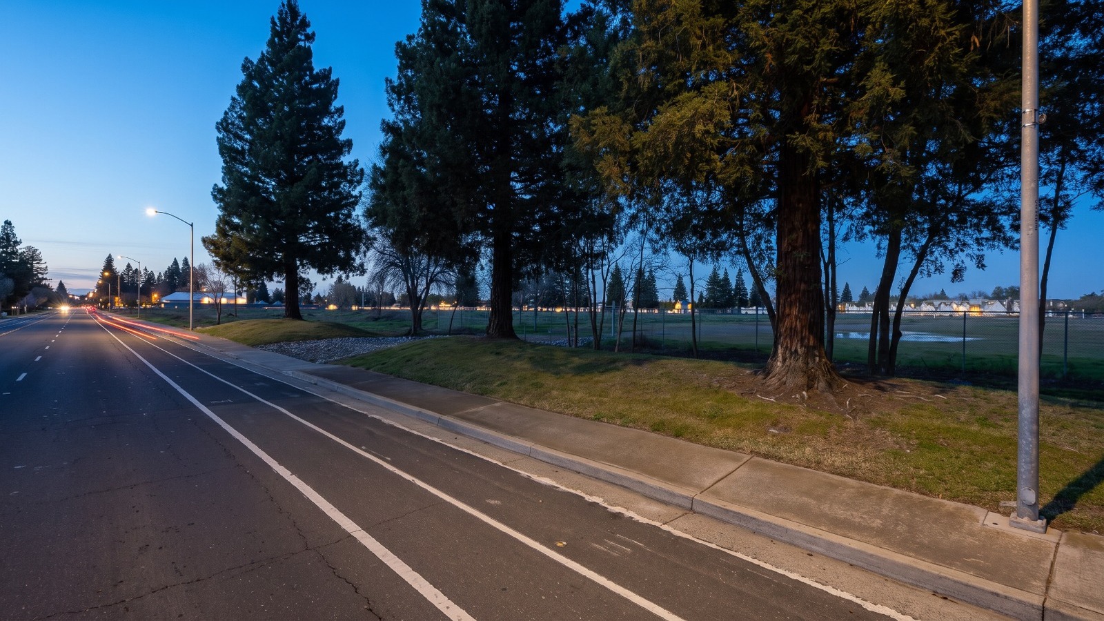AI-rendered view of the empty arena site on Kilgore Road near Trade Center Drive in Rancho Cordova at blue hour, as it looks today