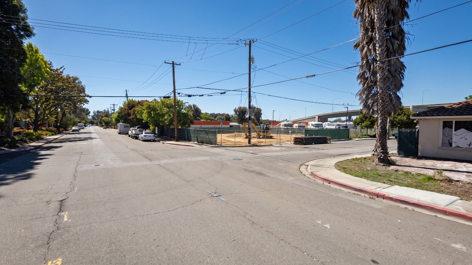 AI-rendered midday view of the fenced La Bella construction site at 1020 Terra Bella Avenue and San Rafael Avenue in Mountain View