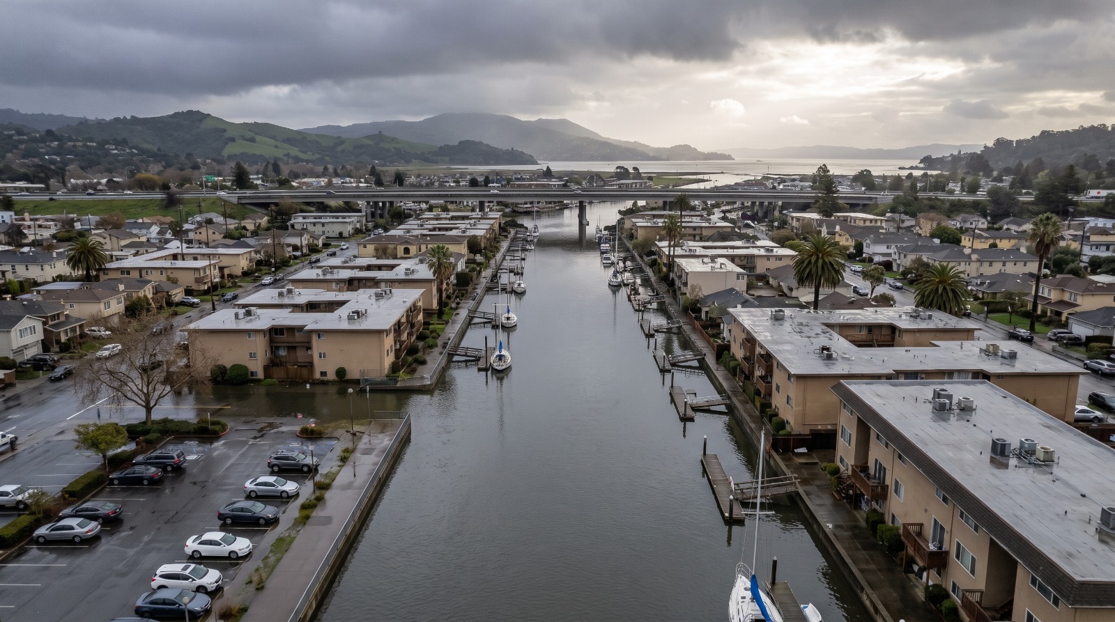 AI-rendered aerial view of the San Rafael Canal District in Marin at a high winter tide under storm clouds