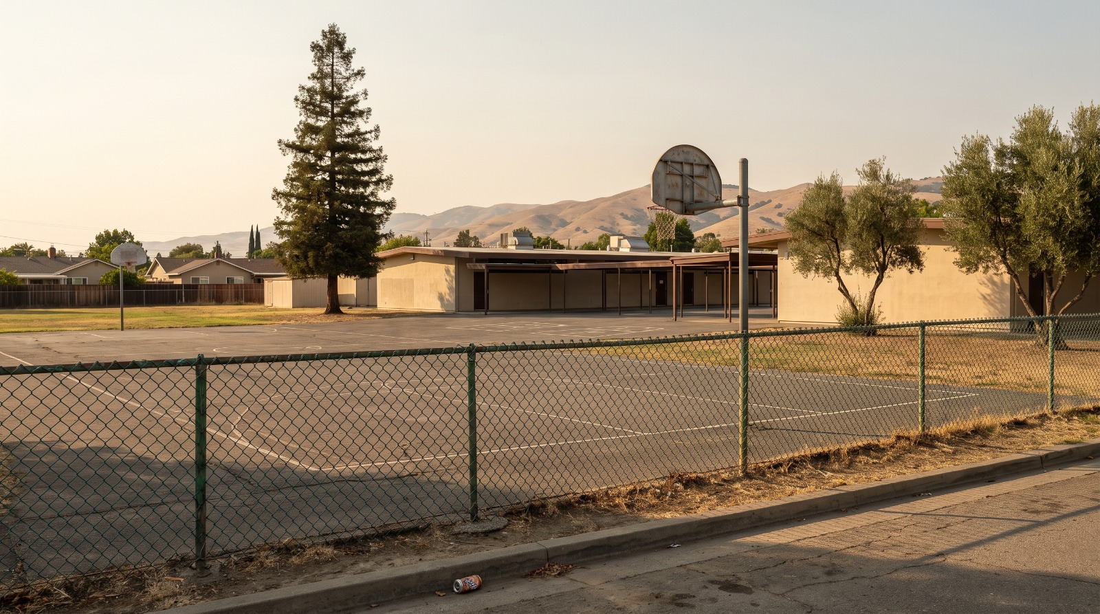 The closed Glider Elementary campus in South San Jose behind a chain-link fence, the site where 80 homes are now planned.