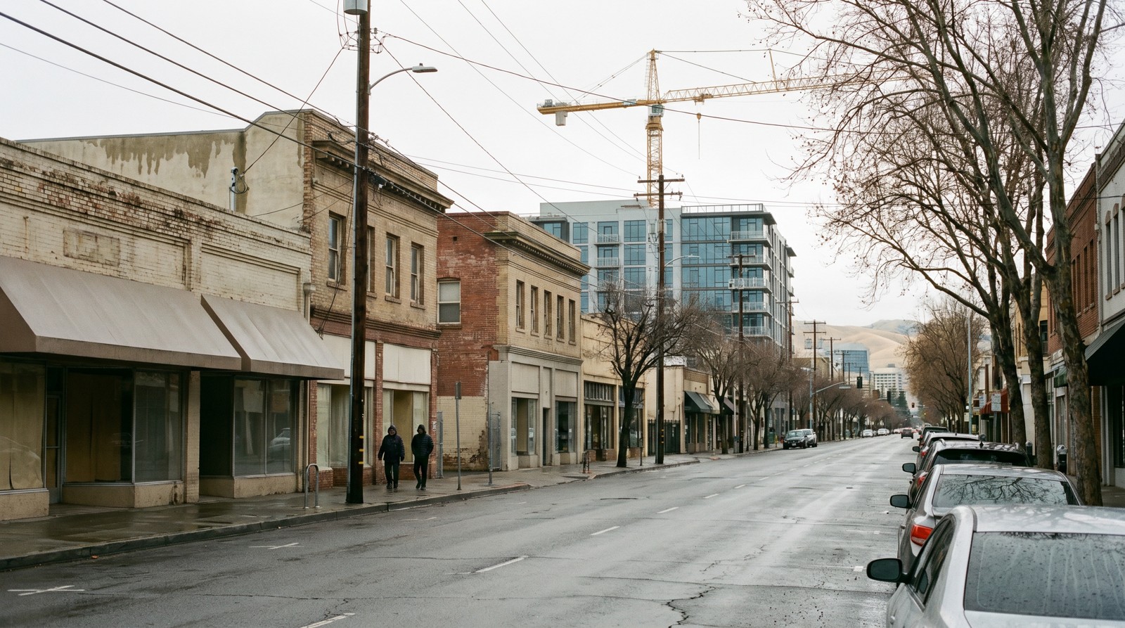 A downtown San Jose street in the SoFA district where new mid-rise housing is going up, illustrating how California's new Housing and Homelessness Agency could speed affordable housing funding.